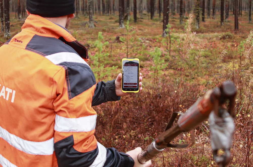 KATI survey team member in the woods